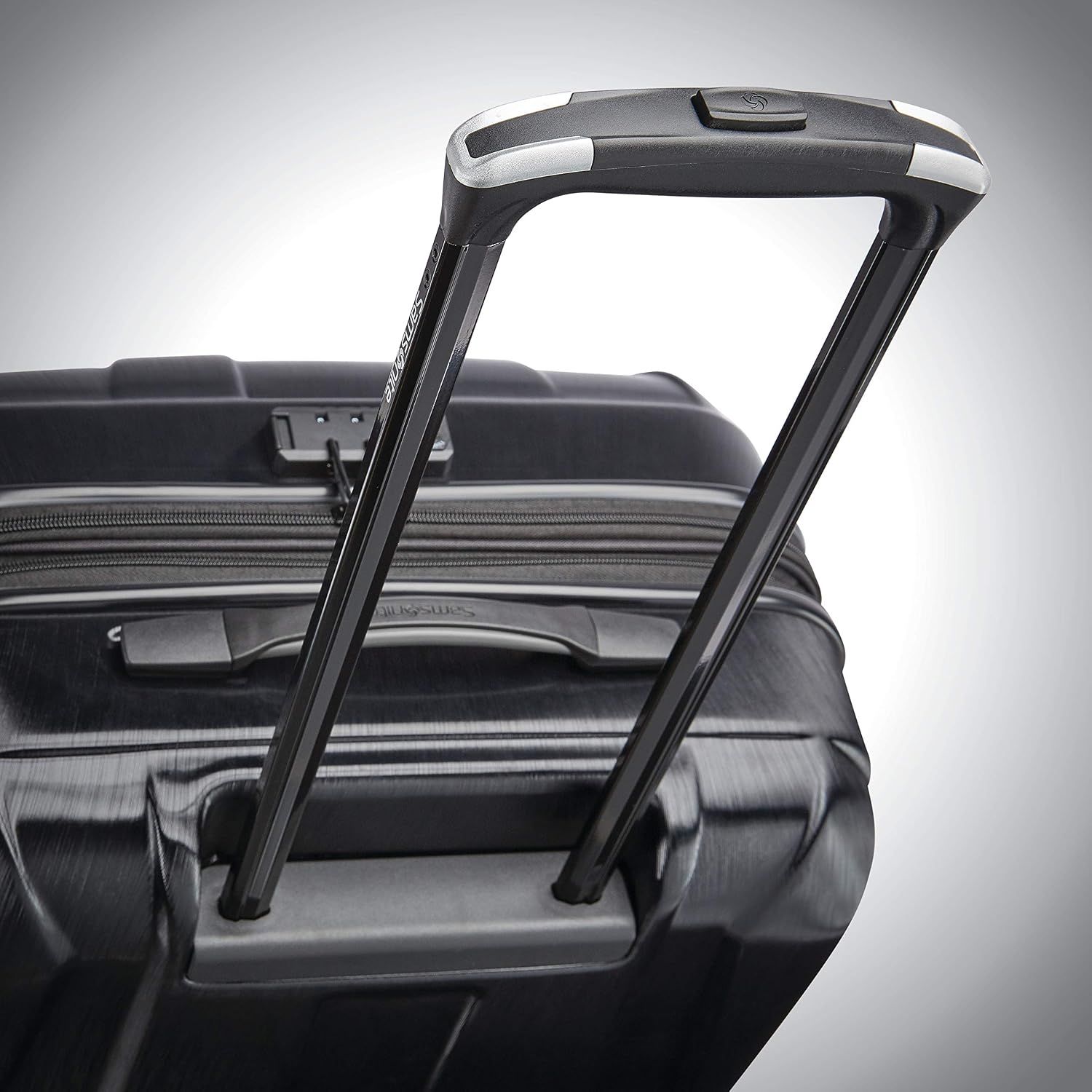 Close-up of the extended trolley handle shows a solid, easy-to-pull handle for comfortable transport.