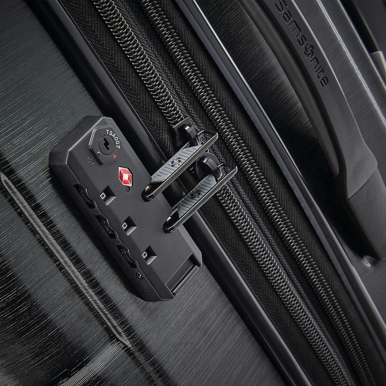 Close-up of the built-in TSA lock shows the bag can be opened by airport security without being broken into. The TSA-approved combination lock reassures travellers that their belongings stay secure…