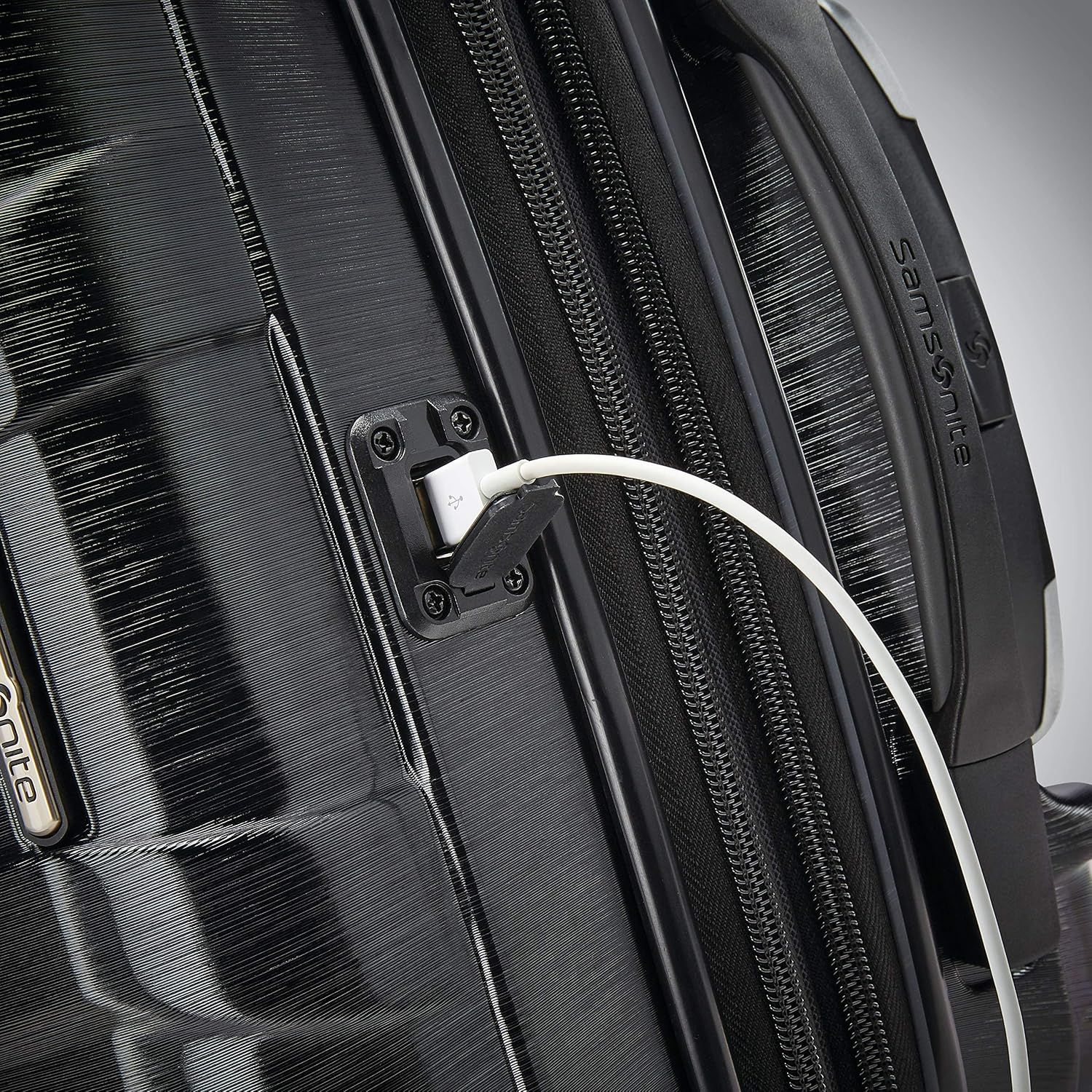 Shows the built-in USB port so shoppers see they can charge devices on the go.
