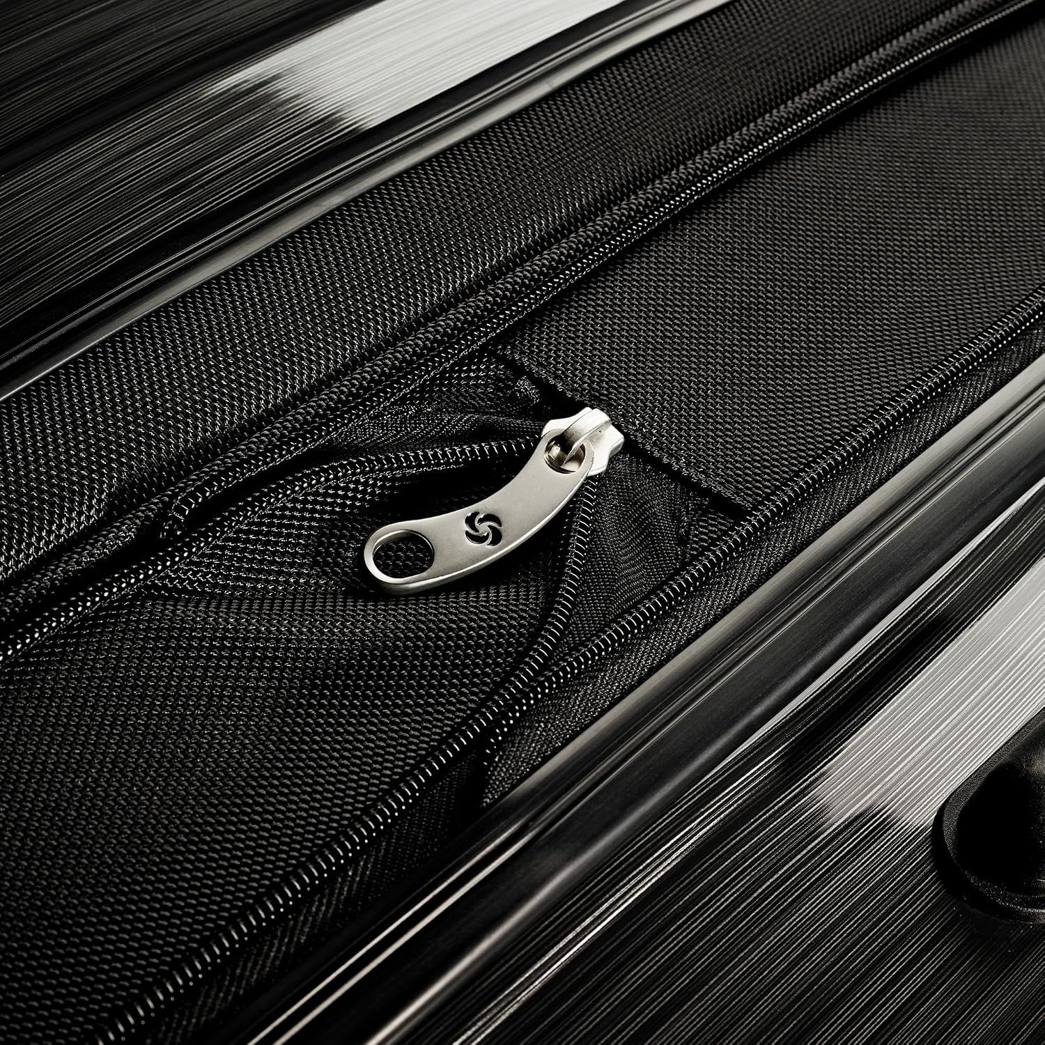 Close-up of the zipper pull and fabric trim signals a finished, well-made closure.