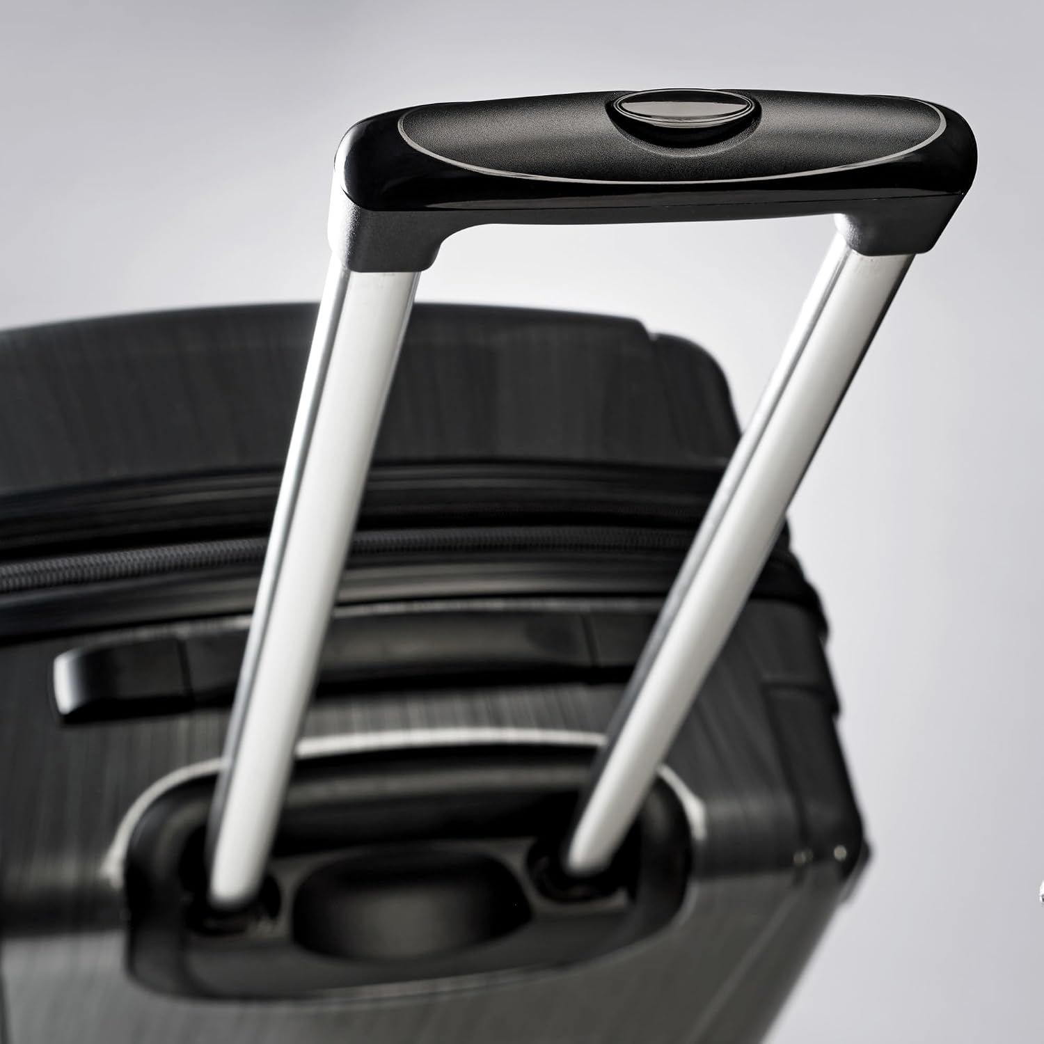 Close-up of the sturdy telescoping handle shows an easy, comfortable pull for airport and hotel travel.