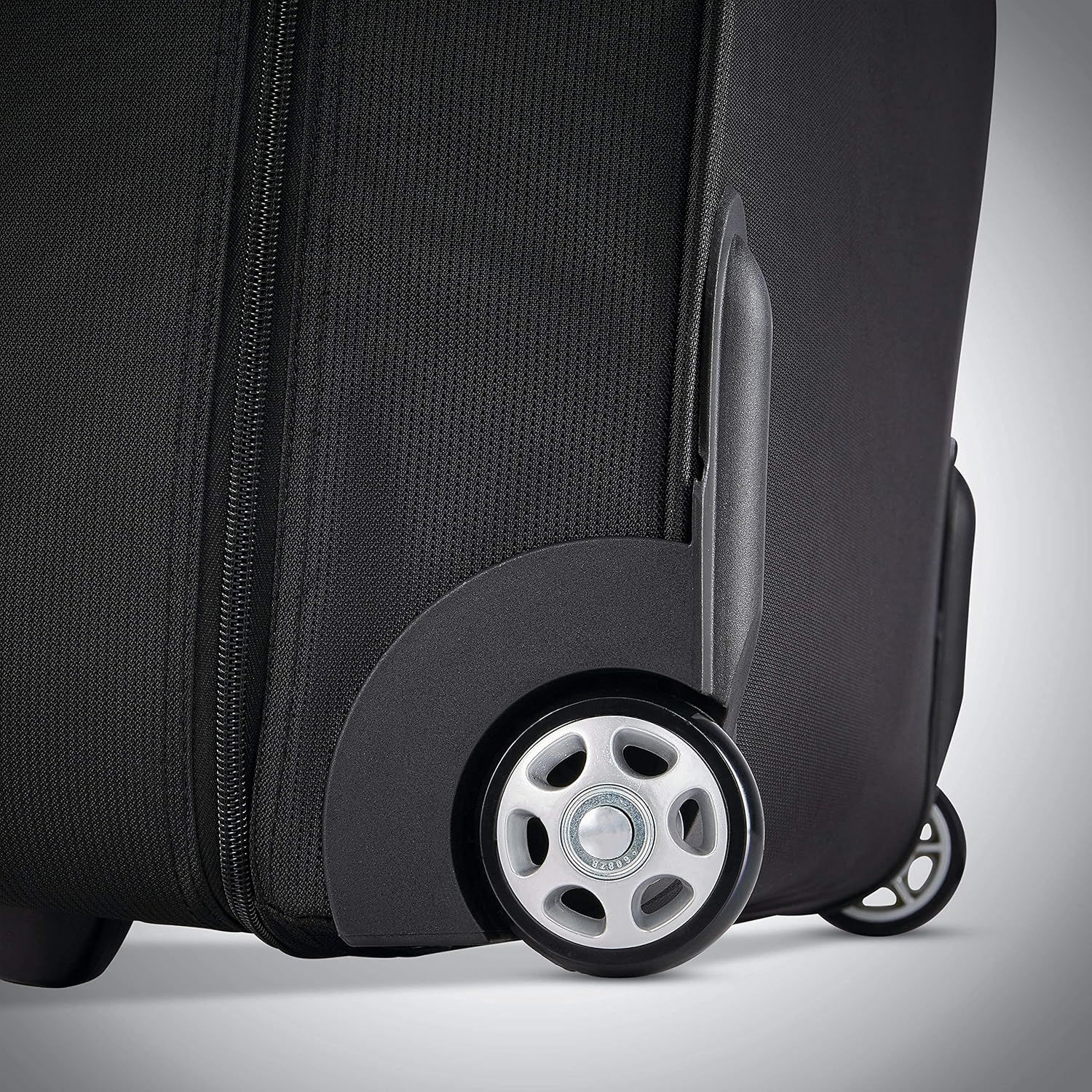 Close-up of the spinner wheels reassures shoppers the case rolls smoothly through airports and hotels.