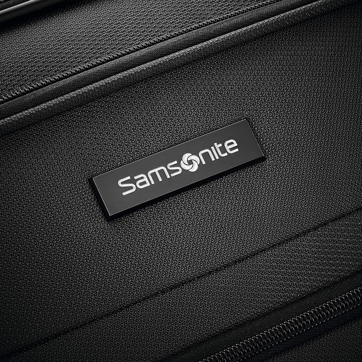 Close-up of the Samsonite nameplate tells shoppers this luggage comes from an established brand.