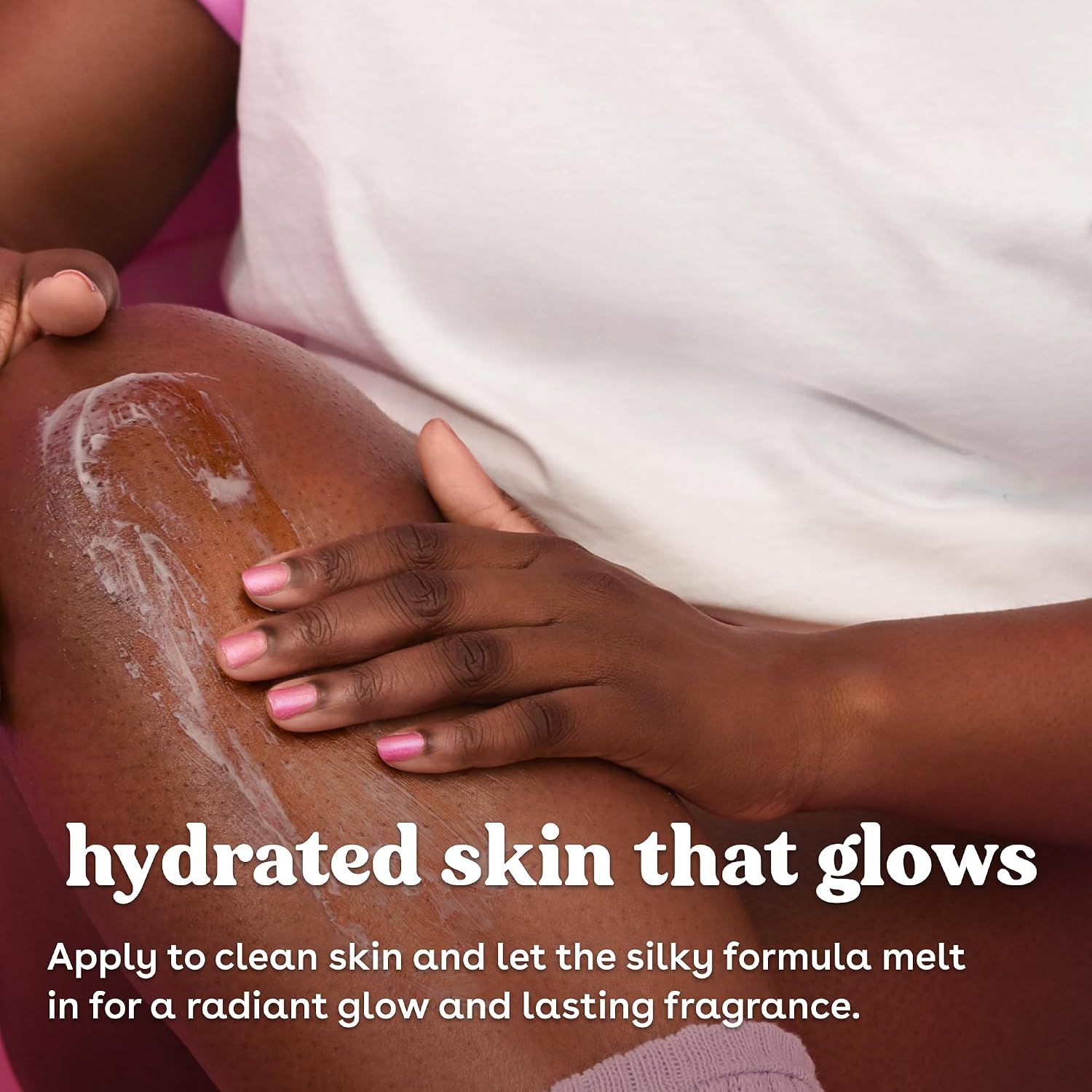 A real hand applying lotion shows the silky formula melting in for a glowing finish and lasting fragrance.