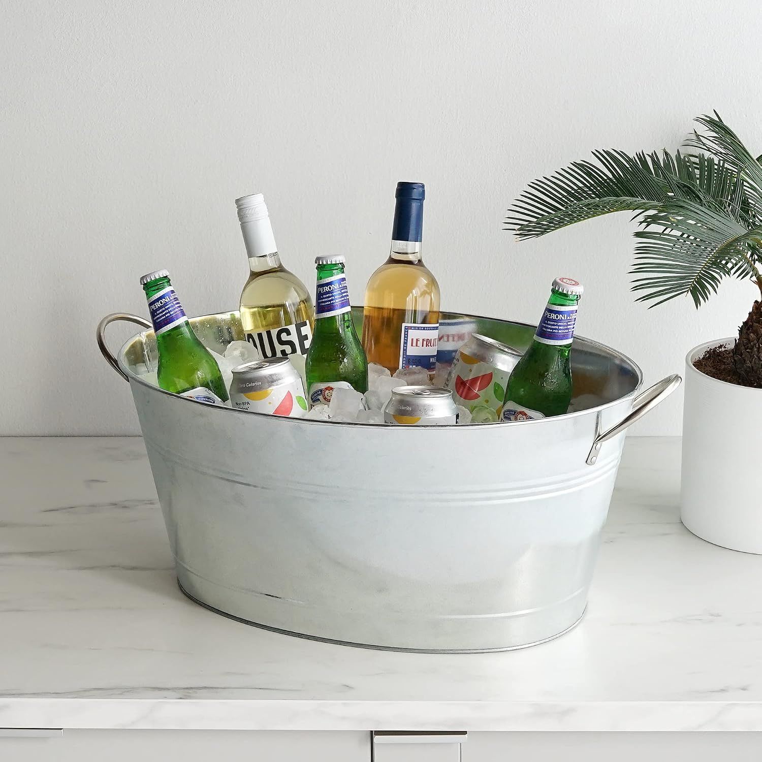 Shows the bucket in a real home setting filled with drinks to inspire entertaining.