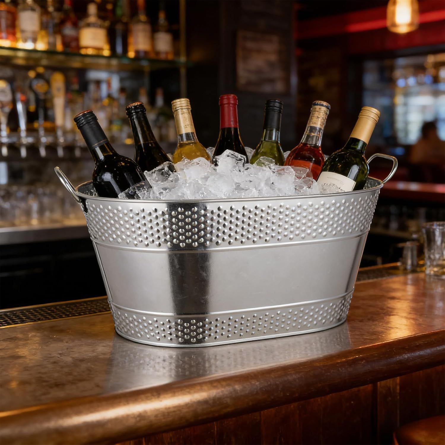 Shows the bucket in a real bar setting with bottles on ice to inspire entertaining use.