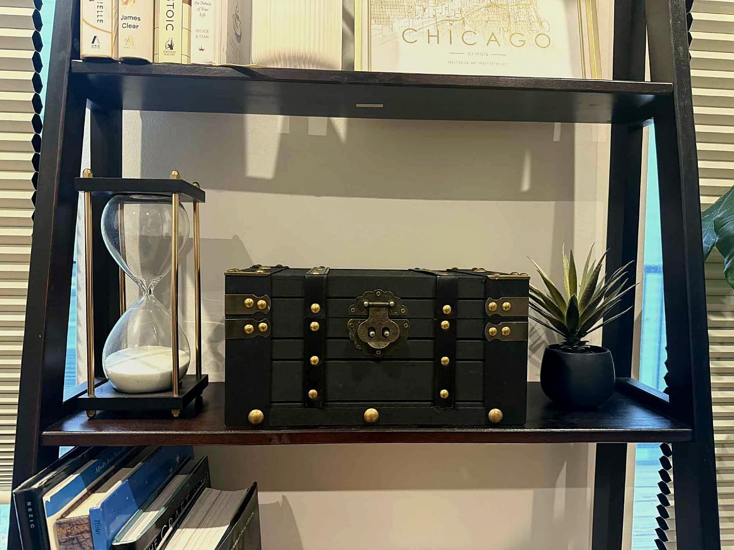Shows the chest styled on a bookshelf as a decorative accent in a real home setting.
