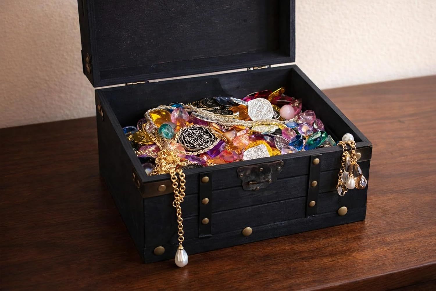 Shows the chest filled with jewelry in a natural setting to convey generous storage capacity.