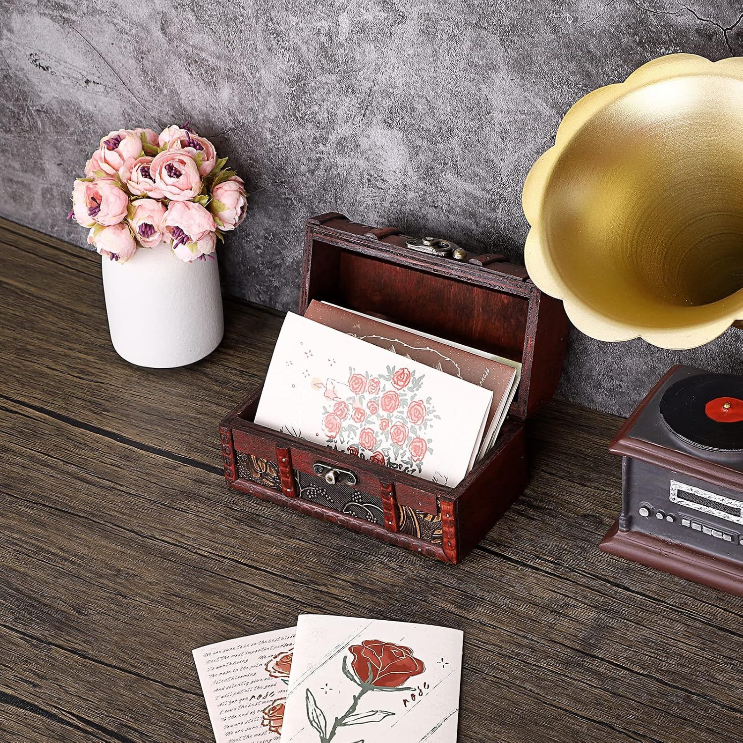 Shows the box holding greeting cards to communicate its use as a keepsake organizer.