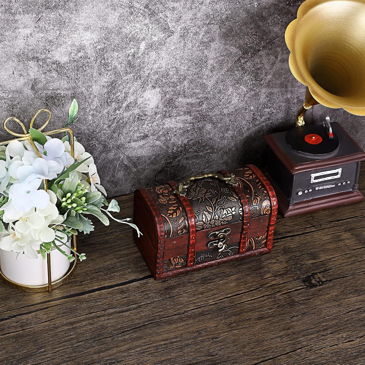Presents the small vintage chest as an attractive compact decorative piece.