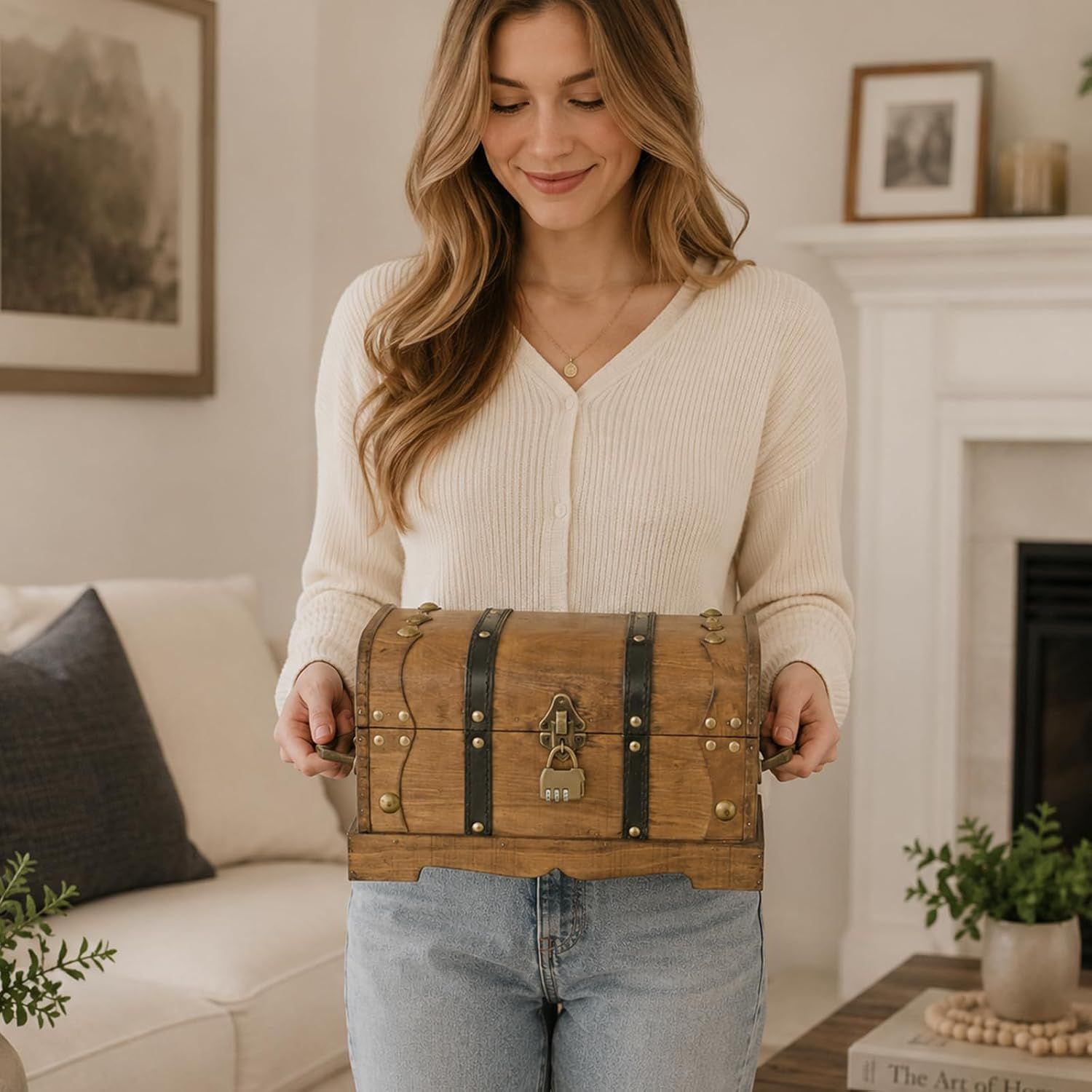 Shows a person easily carrying the trunk by its side handles to suggest it is convenient to move around.