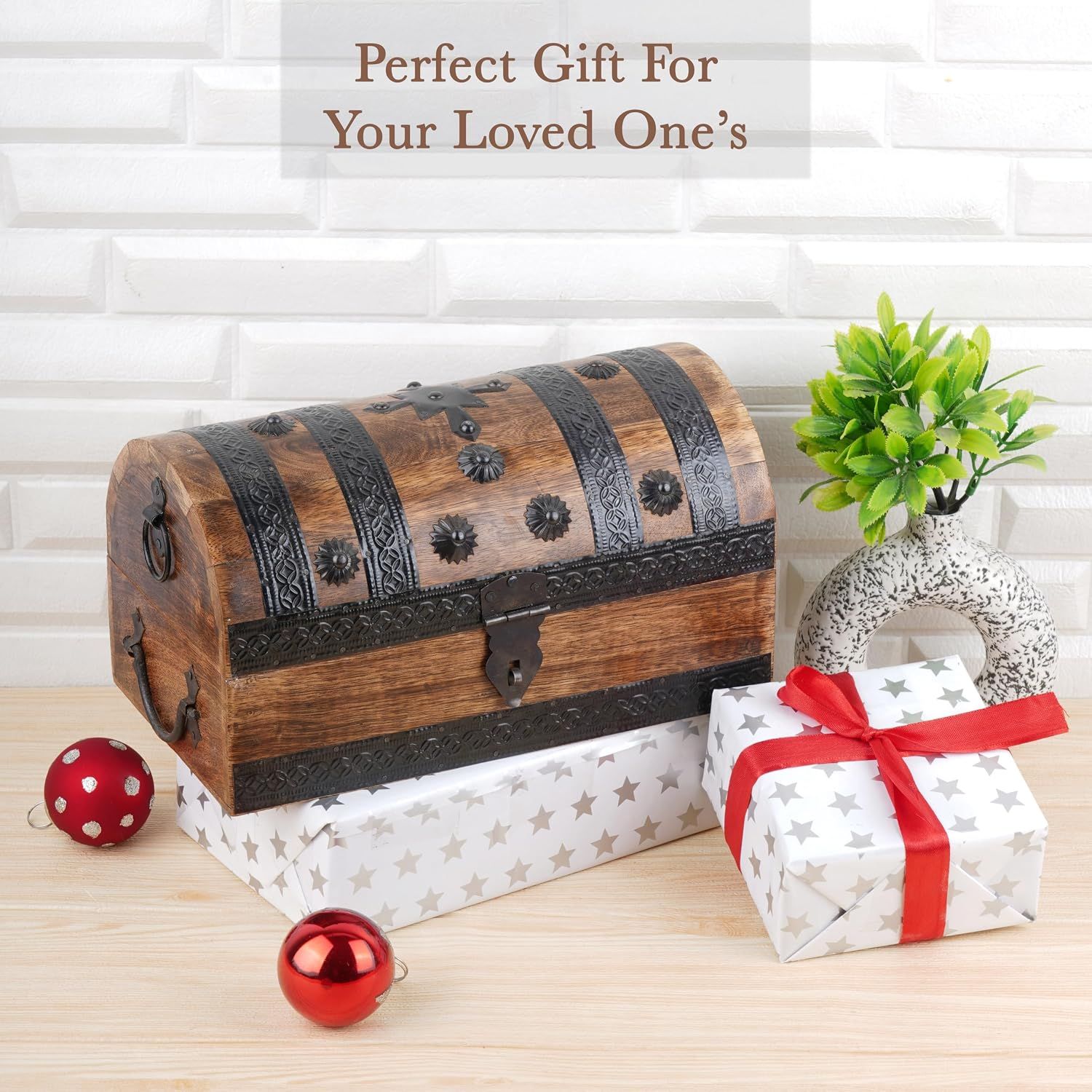 Positions the chest as a holiday gift with festive wrapped presents and ornaments. Communicates that the chest is an appropriate gift for loved ones.