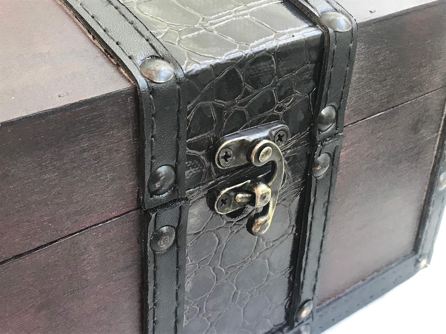 Close-up shows the lock latch and textured trim details so shoppers see the build quality of the chest.