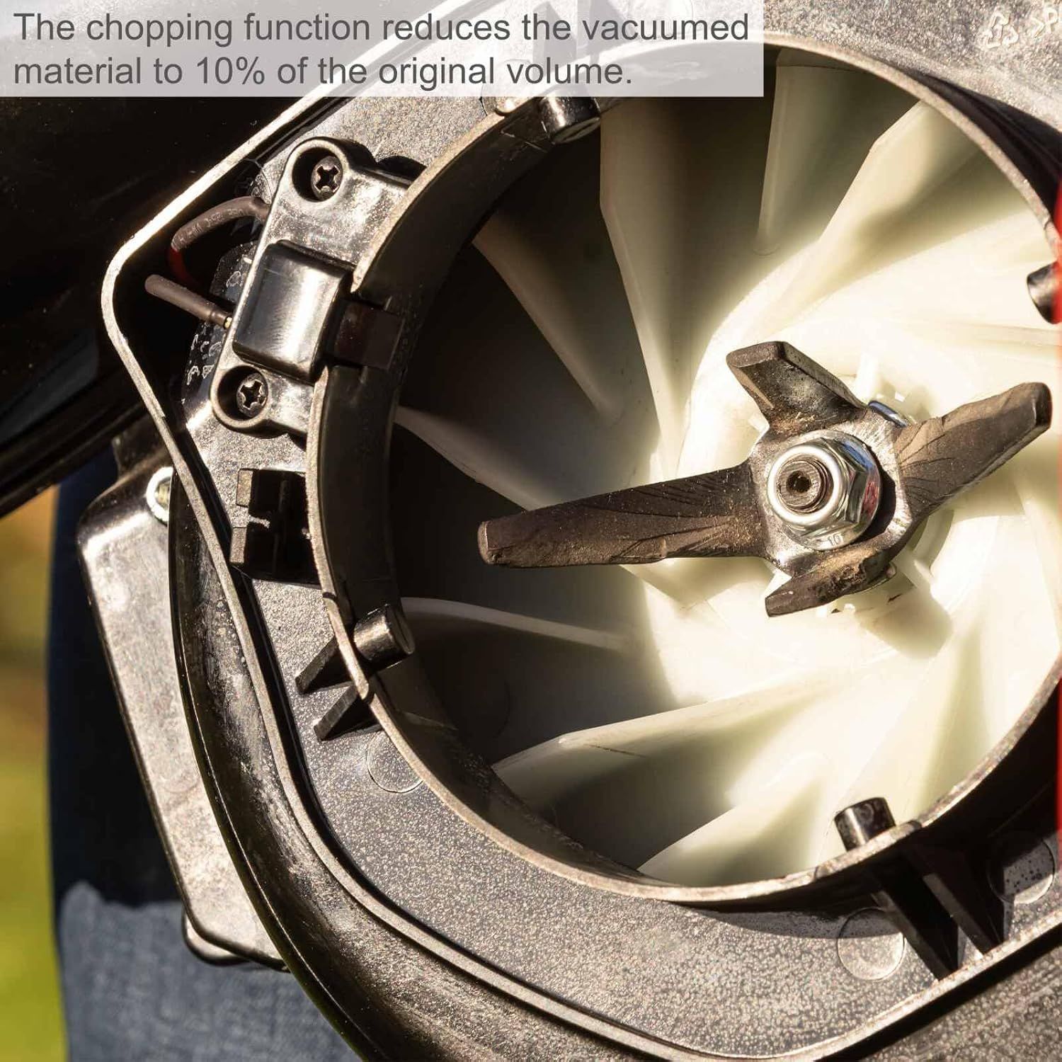 Shows the internal chopping blade to prove the shredding function reduces collected material to 10 percent of its volume. Communicates that the chopping function greatly reduces debris volume for…