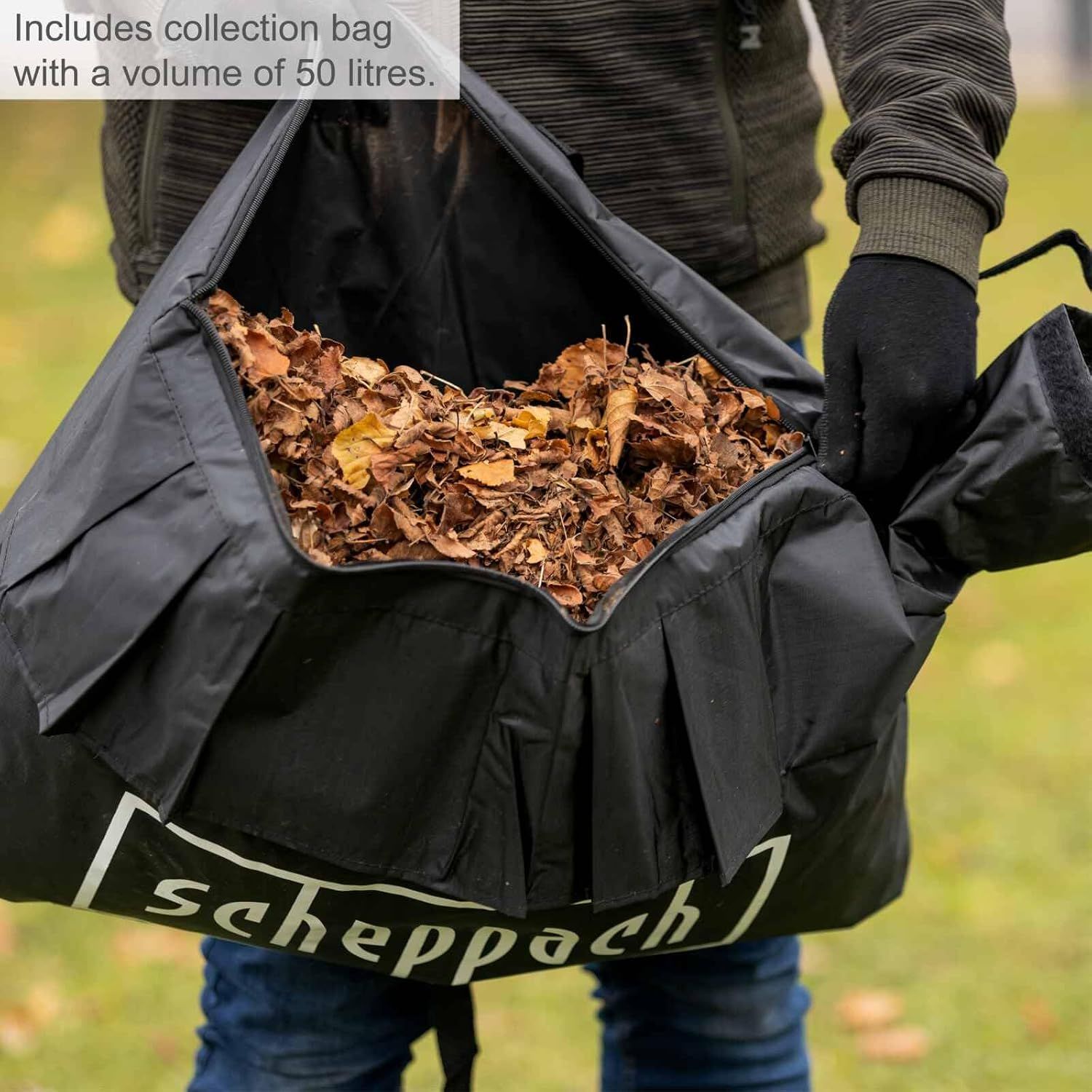 Shows the included 50 litre collection bag filled with leaves to reassure shoppers of its generous capacity.