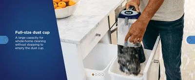 Shows the large dust cup so shoppers know they can clean the whole home without stopping to empty it.