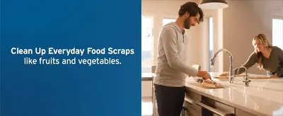 Shows the disposal handling common kitchen scraps like fruit and vegetable waste in a real home setting.