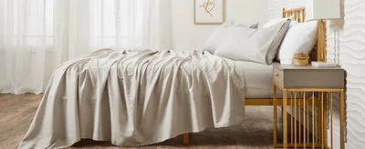 Shows the sheets styled in a real bedroom setting to help shoppers envision the product in their own home.
