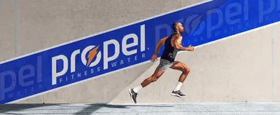 Reinforces the Propel Fitness Water brand identity through bold logo placement and an athletic lifestyle image. Shows an athlete in motion to connect the…