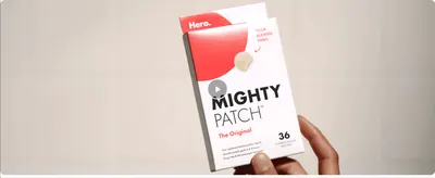 Showcases the product packaging in a video-style hero shot to reinforce brand recognition.