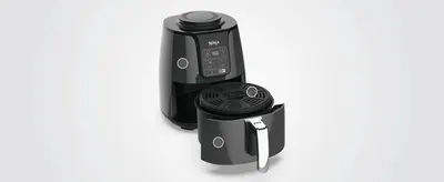 Shows the air fryer and its removable basket on a clean background so shoppers can see the product's full form factor.