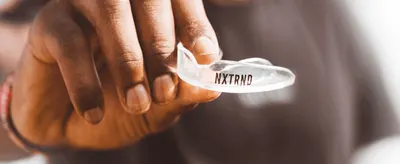 Shows the mouthguard held in hand to give shoppers a real sense of its size, clarity, and material quality.