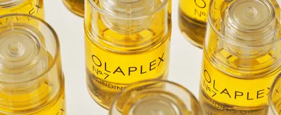 Presents the product itself in an artful close-up with no text or graphics, letting the packaging and liquid color speak for the product.