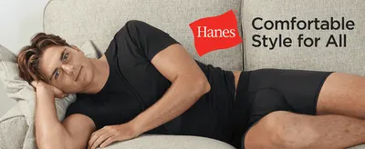Builds brand recognition and warmth with the Hanes logo and the tagline Comfortable Style for All. Shows a man relaxing on a sofa in the underwear to convey everyday comfort.