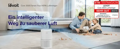 Introduces the product as a smart way to cleaner air through a warm family lifestyle scene and headline claim. Builds trust by showing an independent magazine test award (ETM Testmagazin, 95.6% SEHR…