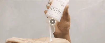 Shows a shopper how to dispense and apply the pre-wash treatment before use. Demonstrates the simple, mess-free way to use the product straight from the bottle.