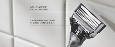 Points to specific parts of the blade cartridge to explain what makes the shave close and comfortable. Highlights two distinct product features via callout lines to build confidence in shave quality.
