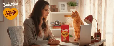 Shows a cat owner and cat at home with the product to create an emotional connection.