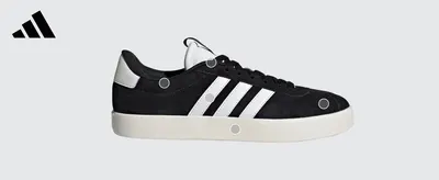 Points to key physical zones of the shoe (heel, stripes, sole) to highlight its build and materials.