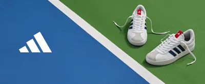 Shows the shoes in a real tennis court setting to help shoppers picture them in use.