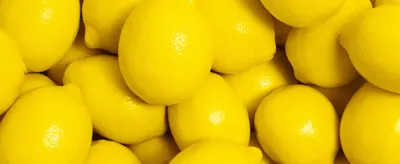 Uses a close-up of fresh lemons to signal natural, real-fruit ingredients.