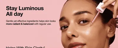 Shows the serum being applied to convey the everyday radiance and clarity benefit shoppers can expect.