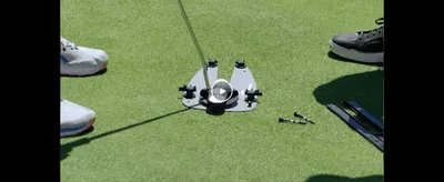 Shows the product set up on a real putting green to help shoppers picture it in use.