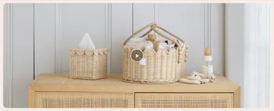 Shows the basket set styled in a real nursery setting to help shoppers envision the product in their own home.