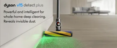 Shows the laser light revealing hidden dust on a hard floor, so shoppers trust the vacuum to clean deeply.