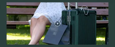 Shows the suitcase in a real-world travel setting to help shoppers envision using it on the go.