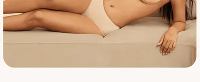 Shows the model reclining in the product with no text overlay, building an aspirational, comfortable feel for the brand.