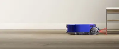 Demonstrates the robot vacuum's ability to navigate under low furniture like cabinets and shelves, reassuring shoppers it can clean hard-to-reach areas.