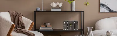 Shows the styled living room setting with neutral decor and boucle seating to help shoppers envision the product within a cozy home environment.