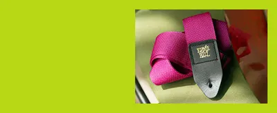 Shows the pink polypro strap up close in a warm, styled setting so shoppers can judge material texture and colour without any text distraction.