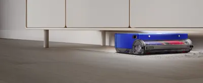 Highlights the vacuum's slim profile and ability to clean beneath furniture, helping shoppers understand it can reach difficult spaces in their home.