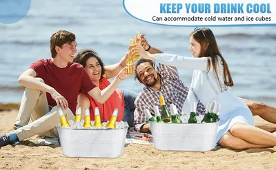 Shows the tub in a relaxed beach setting with friends toasting drinks to help shoppers picture it at their own gatherings. Highlights that the tub holds ice and cold water to keep drinks chilled.