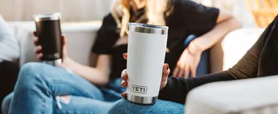 Shows the product being used in a casual social environment to help shoppers envision everyday use and ownership.
