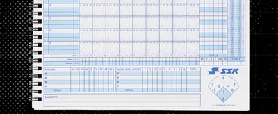 Presents the SSK logo on a baseball scorebook product photo to reinforce brand identity and show the product in a professional setting.