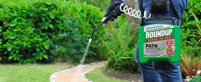 Shows the product being applied to a garden path and driveway edge to demonstrate its suitability for hard surface weed control. Reassures shoppers that this ready to use pressure sprayer delivers…