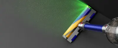 Demonstrates the vacuum's laser illumination feature that reveals hidden dust and debris on floors, helping shoppers understand how the product ensures thorough cleaning.